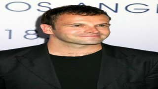 Jonny Lee Miller flashes ink for Ellen charity